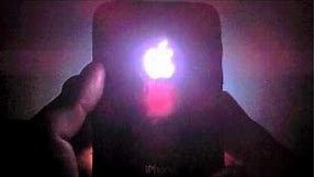 iPhone 3GS with an illuminating Apple Logo.