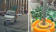 Clumsy driver spills hundreds of cases of beer making sharp turn