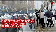 Foxconn protests turn violent, workers clash with security at massive iPhone factory in China