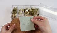 gold paper clips binder clips push pins