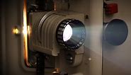 Stock footage - Old film projector running (with sound)