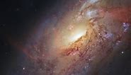 Zoom on Spiral Galaxy Messier 106 in Canes Venatici | Hubble