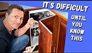 How to adjust a kitchen corner cabinet