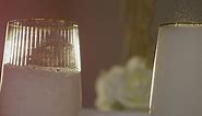 Free stock video - Close up of person pouring champagne into glasses at table set for meal at wedding reception