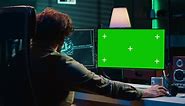 Programmer updating artificial intelligence algorithm using green screen PC, making it become sentient. IT specialist programming self aware AI with mockup computer, camera A
