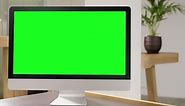 Premium stock video - Apple imac computer with green screen on office table