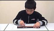 Student shows his abacus (soroban) skills!