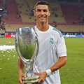 CR7 Holding a Trophy in Real Madrid