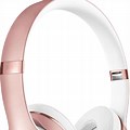 Person Wearig Rose Gold Beats
