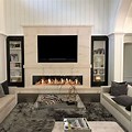 Transitional Living Room Decorating with TV above Fireplace