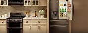 Cream Kitchen Cabinets with Stainless Steel Appliances