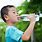 A Boy Drinking Water