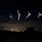 Bats Flying in the Night Sky