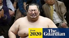 Japan in raptures as outsider wins sumo contest – and bursts into tears