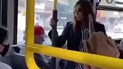 Woman pushed off bus after spitting on asian man.