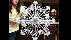 DIY Hangers Snowflake Instructions on How To make Christmas Décor, made from simple plastic hangers.