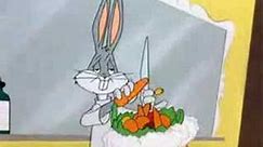 Bugs Bunny makes fruit salad on elmer fudds head