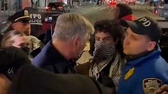 Alec Baldwin, demonstrators argue at rally