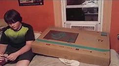 William unboxes a 40" tv he bought from the Walmart Black Friday Sale for $150