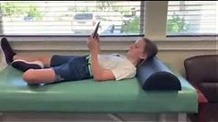 Dr. Baxter Demonstrates good and bad posture for children using home electronic devices.