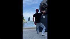 Runaway skateboard bounces off sculpture and falls in lake