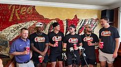 National champion Tigers serve fans at Raising Cane’s