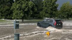 Cars Drive Through 'Raging' Water Amid Flash Flood Warnings in Denver