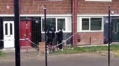 WATCH: Police officers point to bulletholes in windows of flats in Sheffield after reported shooting