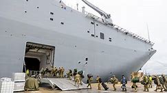 Australia warship with crew infected with COVID-19 offloads aid to Tonga