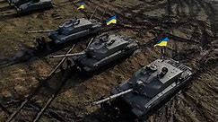 RAW VIDEO: British Challenger 2 Tanks Arrive In Ukraine Ready For Deployment On Battlefield
