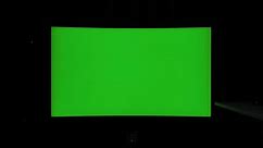 Premium stock video - 422 10 bit static shot, curved tv green screen at night in a dark room with ambient lighting