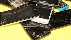 Close-up of used smartphones with a broken screen. Repair of smartphones. Disposal of gadgets