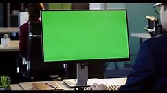 Businessman Working On The PC Computer Green Screen And Typing On The Keyboard in The Office