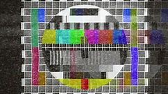 4k analogue old CRT TV test card with color bars, full of noise, static, grain, ghosting artifacts.