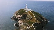 Image result for Phare de South Stack. Size: 176 x 100. Source: walesguidebook.com