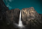 Image result for Waterfall at Night. Size: 143 x 100. Source: wallpapercave.com