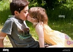 Résultat d’image pour filles qui s'embrassent. Taille: 147 x 106. Source: www.alamyimages.fr