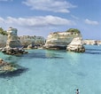 Image result for Puglia spiagge. Size: 114 x 106. Source: www.dagilupi.com