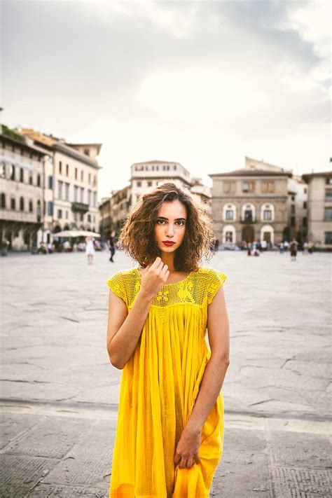 Beautiful Young Woman With A Yellow Dress Outdoors By Stocksy