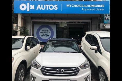 olx autos franchisee model  pre owned car dealerships launched autocar india