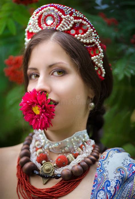 Ethnic Russian National Costume Woman With A Flower At ÑŒÑ‰Ð³ÐµÑ€ Stock
