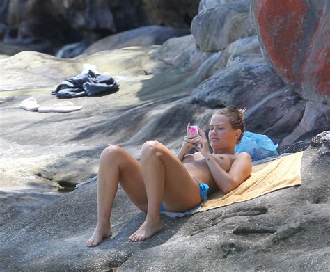 lara bingle candid beach topless celebrity