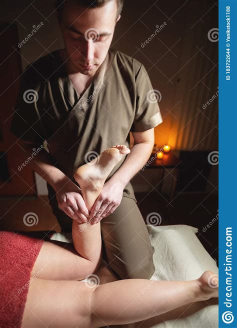 Professional Foot Massage In A Dark Massage Room Premium Lacheri Foot