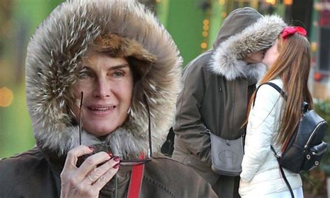 brooke shields gives her daughter a kiss during shopping