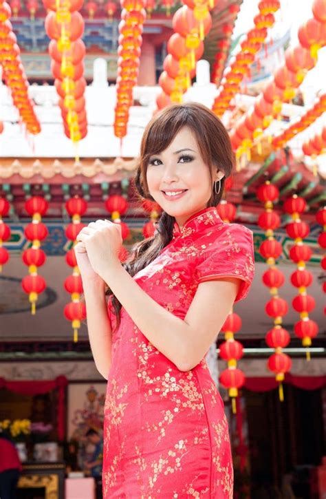 asian chinese female in traditional cheongsam dress in a temple stock