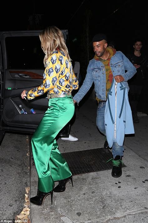 rita ora teams gucci blouse with green satin trousers daily mail online