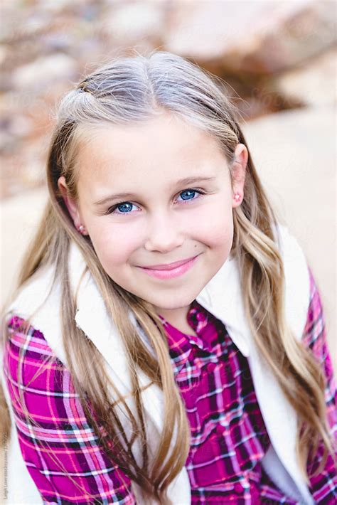 Portrait Of A Blue Eyed Girl With Long Blonde Hair By Stocksy