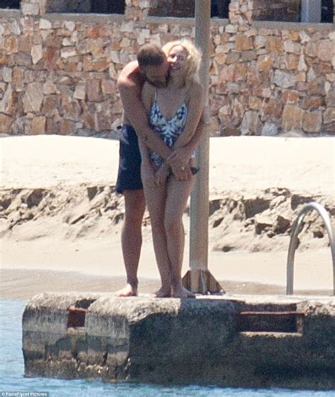kylie minogue looks sensational in a swimsuit with fiance