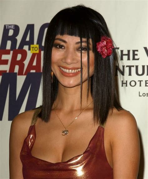 Bai Ling Long Blunt Cut Bob With Short Bangs And A Flower In The Hair