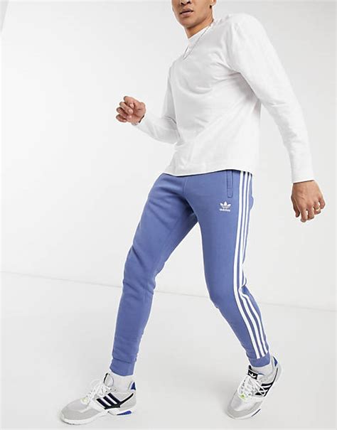 adidas originals adicolor joggingbroek met  stripes  blauw asos